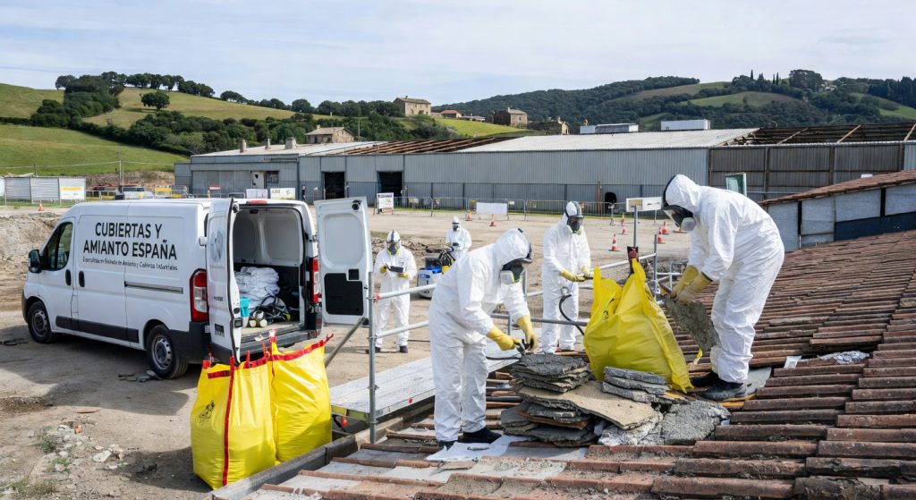 Professional high-quality commercial photograph for a business article about: Retirada de amianto Cantabria. Context: empresa Cubiertas y Amianto España del sector Empresa de cubiertas. Photorealistic, commercial photography style, natural daylight, no text overlays, no watermarks.